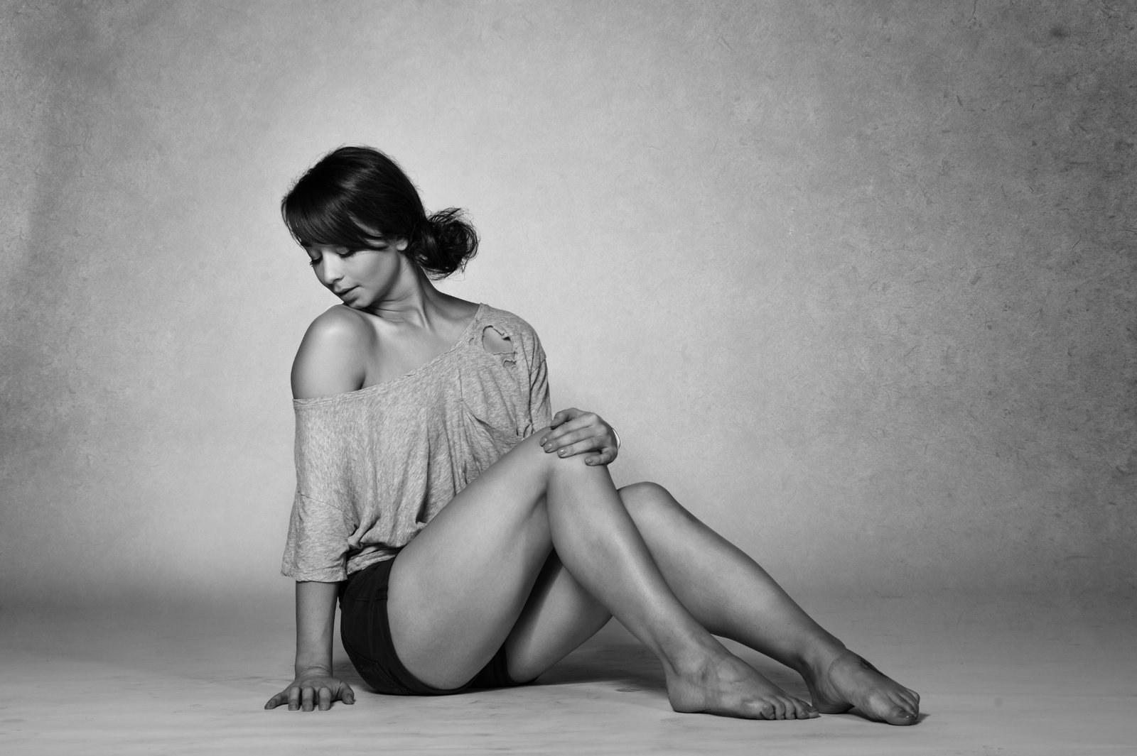 Fine-art seated boudoir portrait in monochrome